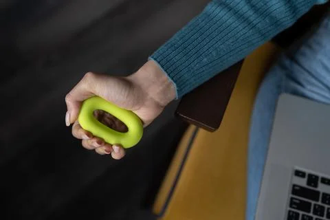Closeup of hand training with expander to prevent carpal tunnel syndrome wrist Stock Photos