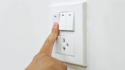 Closeup hand turn light switch off. energy saving concept Stock Footage 196910765