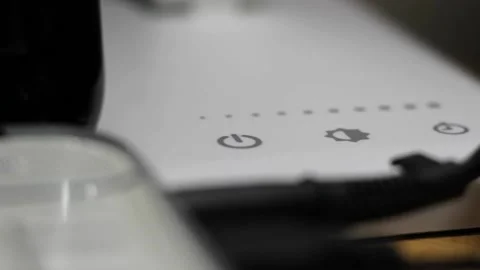 Closeup of hand turning off lamp to dark. Video stock 131474030