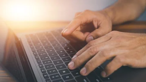 Closeup Hand using computer keyboard Stock Photos
