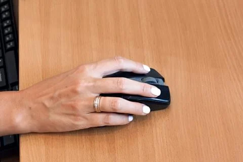 Closeup of hand using computer mouse Stock Photos