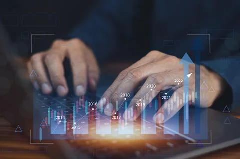 Closeup hand using computer trading online on digital chart visual screen tec Stock Photos