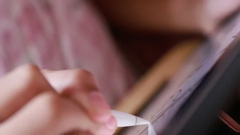 Closeup hand using digital pen drawing sketching on digital tablet Stock Footage 180981645