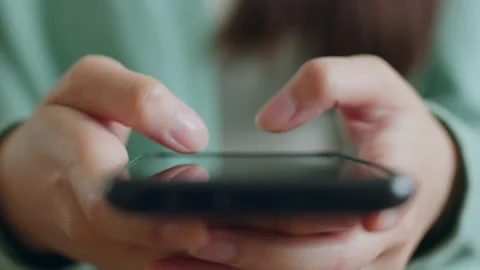 Closeup hand using mobile smartphone for chatting in social media Stock Footage 196900553