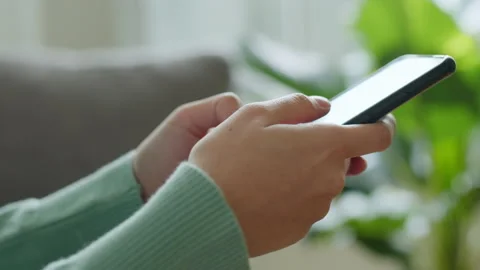 Closeup hand using mobile smartphone for chatting in social media Stock Footage 196900557