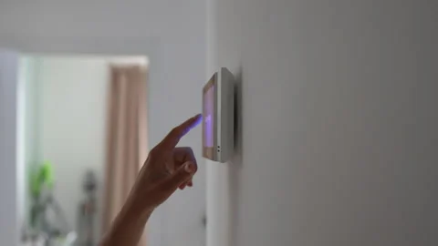 Closeup hand using smart home panel, touching screen with connected appliances Stock Footage 283049112