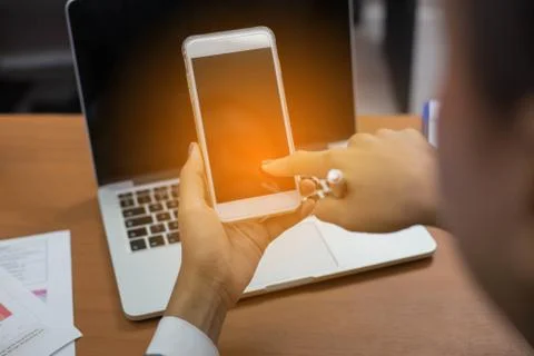 Closeup of hand using smartphone with effects Stock Photos