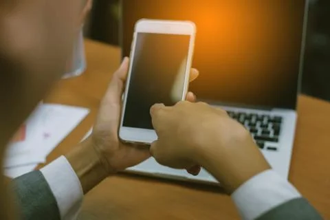 Closeup of hand using smartphone with effects Stock Photos