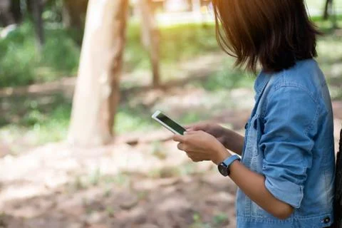 Closeup of hand using smartphone with effects Stock Photos