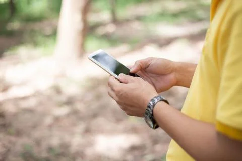 Closeup of hand using smartphone with effects Stock Photos