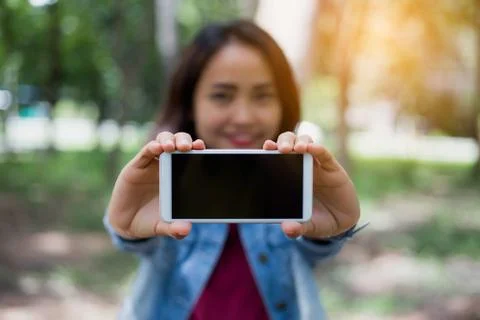 Closeup of hand using smartphone with effects Stock Photos