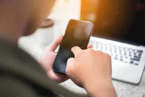 Closeup of hand using smartphone with effects Stock Photos