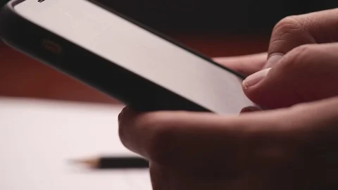 Closeup of hand using smartphone. Male typing text message via cellphone Video stock 125724744
