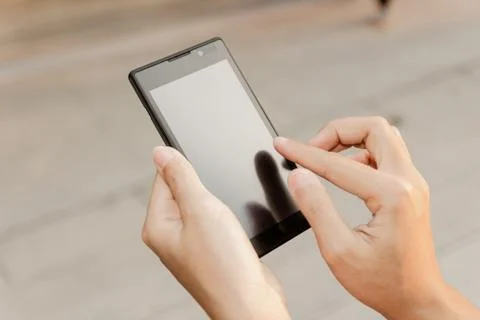 Closeup hand using smartphone mobile Stock Photos