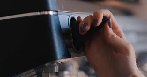 Closeup of hand which pushing button on professional coffee mashine. Bright shot Stock Footage 107416885