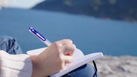 Closeup of hand writing on a notebook. Stock Footage 288326068