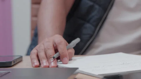 Closeup of Hand Writing Notes at Office Desk Stock Footage 327359621