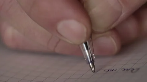 Closeup of hand writing with a pen. Shallow depth of field Stock Footage 168752001
