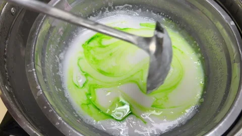 Closeup of handmade bar soap making process. Adding color step Stock Footage 329911260