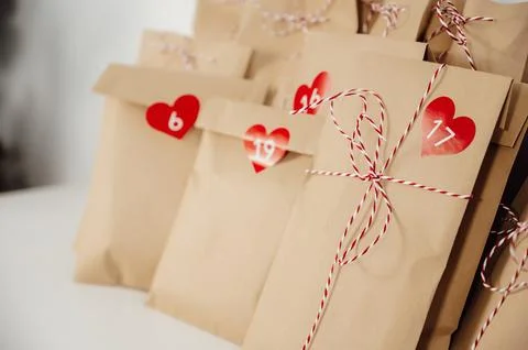 Closeup Handmade rustic advent calendar bags with small gifts for christmas eve Stock Photos