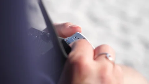 Closeup of hands changing film camera focus settings Stock Footage 112118997