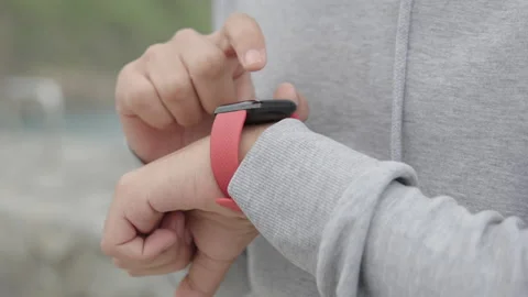 Closeup of hands checking heart rate on smartwatch Stock Footage 217372145