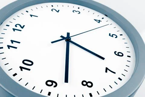 Closeup of hands on clock face Stock Photos