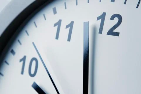Closeup of hands on clock face Stock Photos