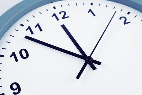 Closeup of hands on clock face Stock Photos