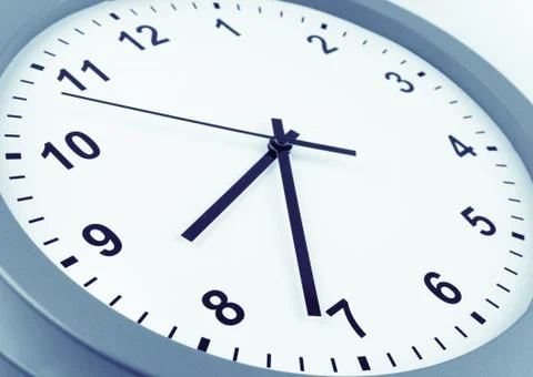 Closeup of hands on clock face Stock Photos