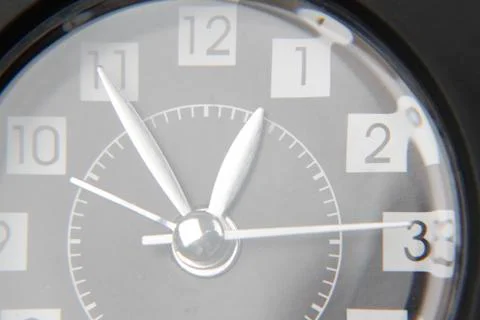 Closeup of hands on clock face Stock Photos