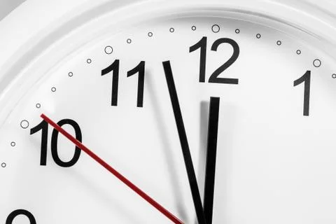 Closeup of hands on clock face.sensitive focus Stock Photos