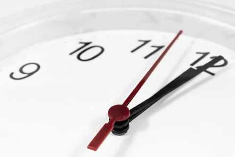 Closeup of hands on clock face.sensitive focus Stock Photos