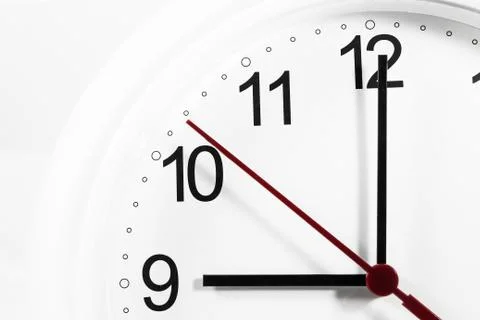 Closeup of hands on clock face.sensitive focus Stock Photos