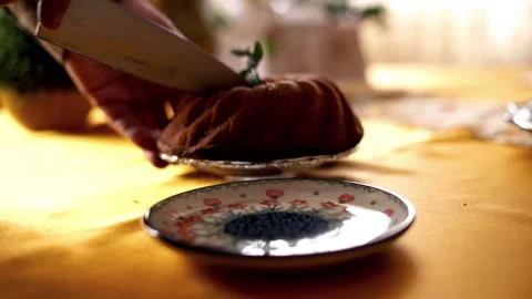 Closeup of hands cutting bundt cake, super slow motion Stock Footage 103804374