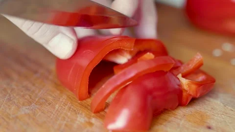 Closeup of hands cutting sweet bellpepper. Halthy food concept. Eco vegetables.  Video stock 305849906
