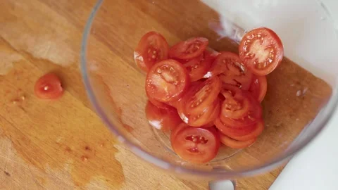 Closeup of hands cutting tomatoes. Halthy food concept. Eco vegetables. Cooking  Video stock 305847673