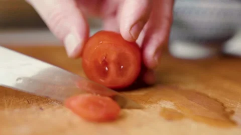 Closeup of hands cutting tomatoes. Halthy food concept. Eco vegetables. Cooking  Video stock 305848008