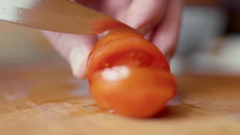 Closeup of hands cutting tomatoes. Halthy food concept. Eco vegetables. Cooking  Video stock 305848991