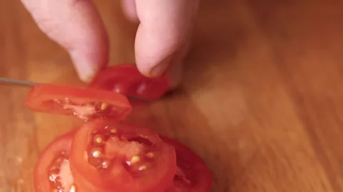 Closeup of hands cutting tomatoes. Halthy food concept. Eco vegetables. Cooking  Video stock 305849207