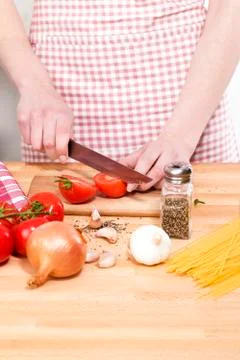 Closeup of hands cutting tomatoes Stock Photos