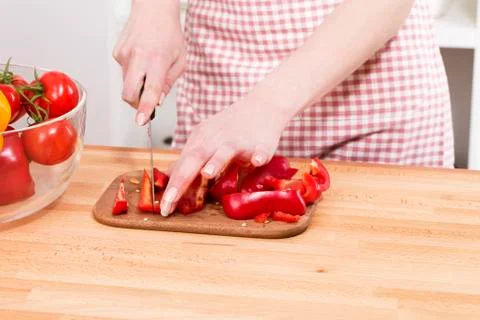 Closeup of hands cutting vegetables Stock Photos