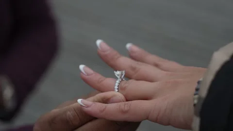 Closeup Of Hands With Diamond Ring During Outdoor Proposal On Wooden Path With Video stock 323773308