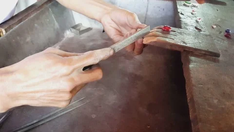 Closeup of hands file silver medallion, jewelry, glass stone, Inle Lake, Myanmar Видео 79839857