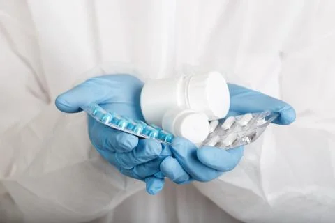 Closeup of hands in gloves with tablets Stock Photos