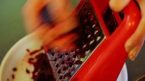 Closeup of hands grating boiled beetroot Stock Footage 40732302