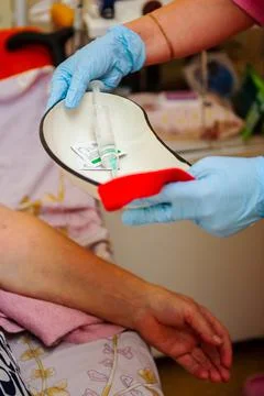 Closeup of the hands of a heathcare worker Stock Photos