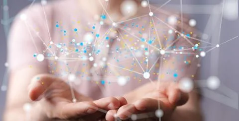 Closeup of hands holding a 3D rendered scheme for a global networking concept Stock Photos