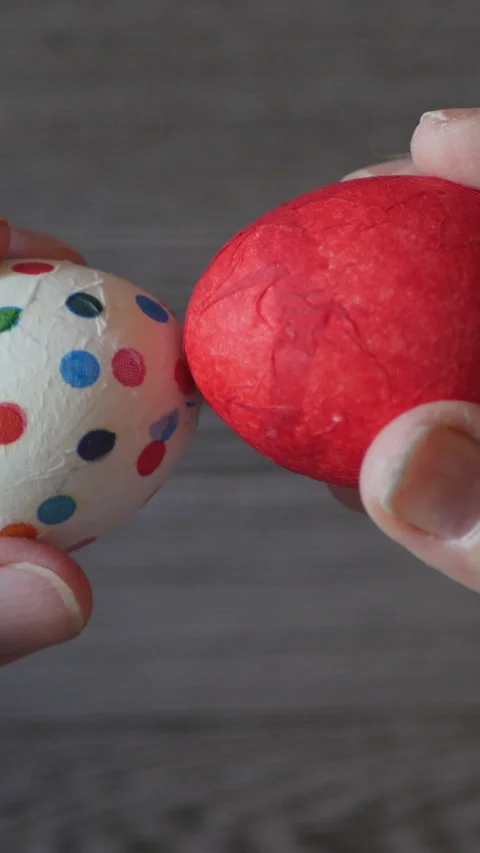 Closeup Of Hands Holding Decorated Easter Eggs During Festive Celebration. Stock Footage 302552709