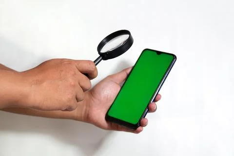 Closeup of hands holding smart phones with green screen and show another cl.. Stock Photos